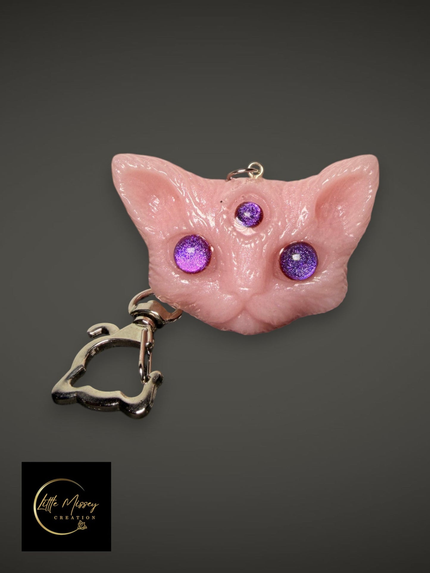 Little Missey Creation pink three-eyed cat fantasy creature keychain with sparkling purple eyes and metal clasp