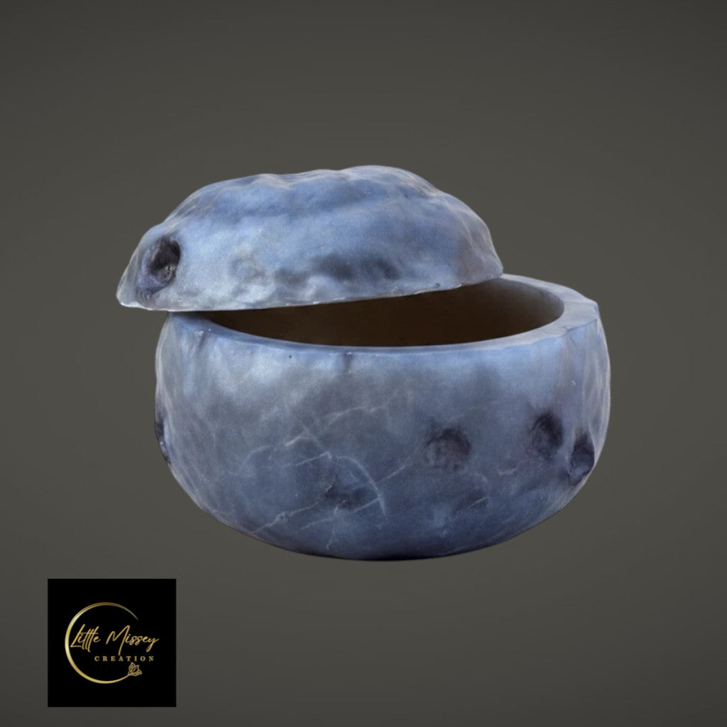 Moon-shaped resin jewelry box in a textured grey finish for storing crystals and rings.