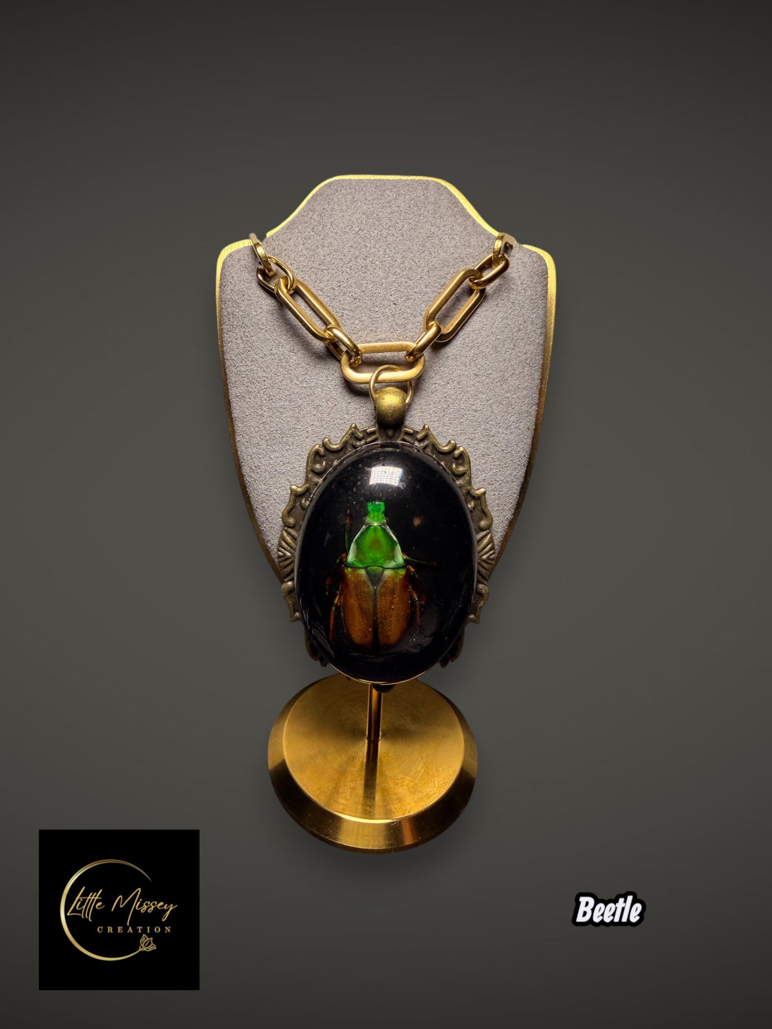 Little Missey Creation beetle pendant necklace featuring an iridescent green beetle in resin with antique bronze frame.