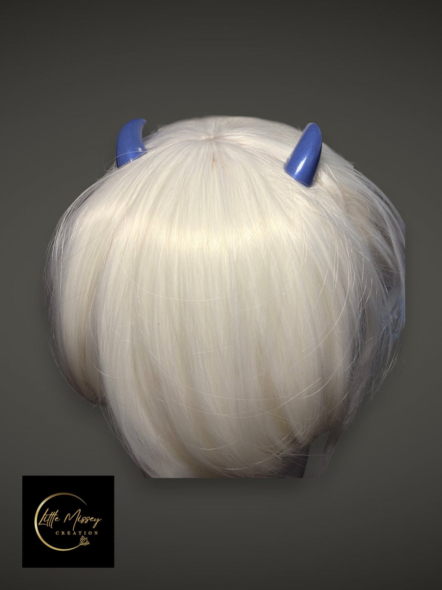 Little Missey Creation glossy blue cosplay horns attached to a short white wig for fantasy character costumes