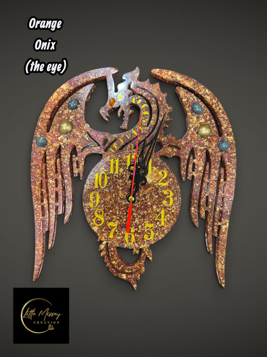 Little Missey Creation dragon wall clock in textured orange and gold with an onix eye and vibrant yellow numerals.