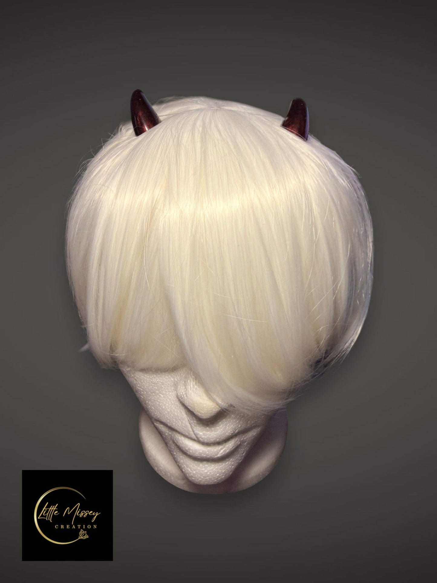 Little Missey Creation dark red glossy demon horns on a white wig, perfect for Zero Two cosplay and fantasy costumes.