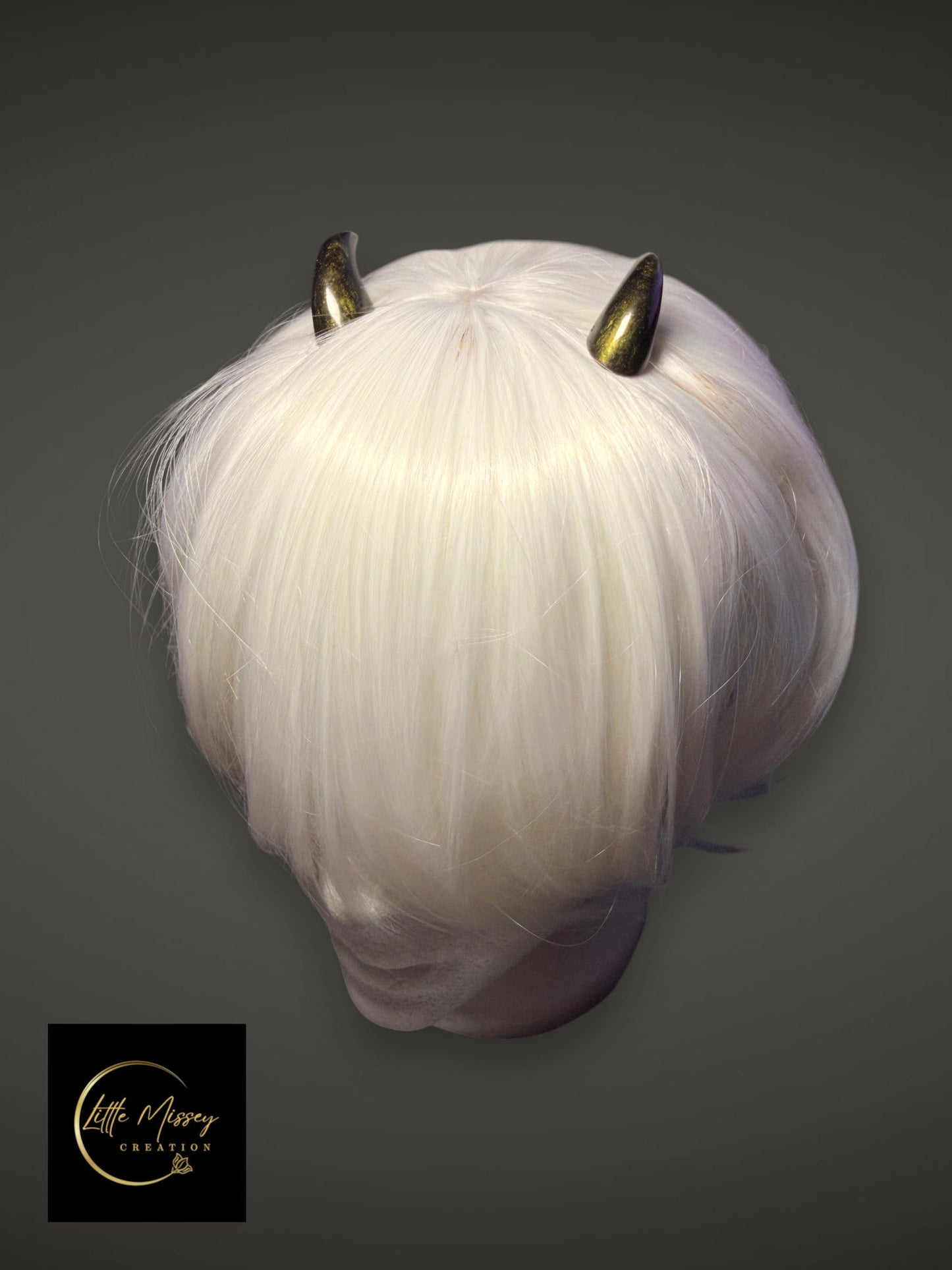 Little Missey Creation handcrafted metallic gold demon horns styled on a short white cosplay wig