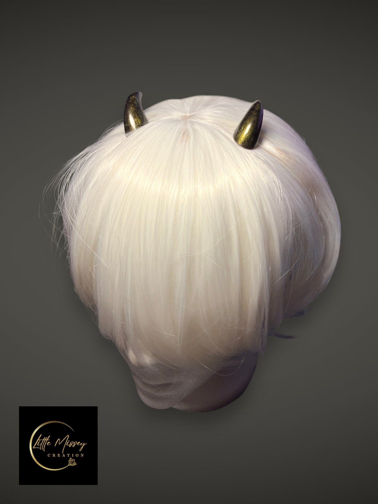 Little Missey Creation handcrafted metallic gold demon horns styled on a short white cosplay wig