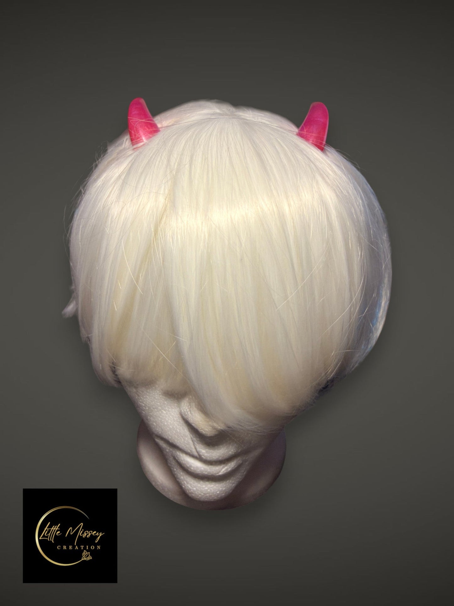 Little Missey Creation white cosplay wig featuring glossy pink demon horn accessories on a mannequin head