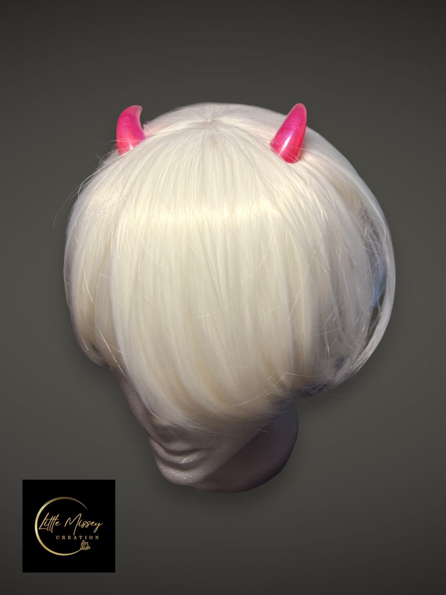 Little Missey Creation pink glossy demon horn accessories worn on a white bob wig for cosplay