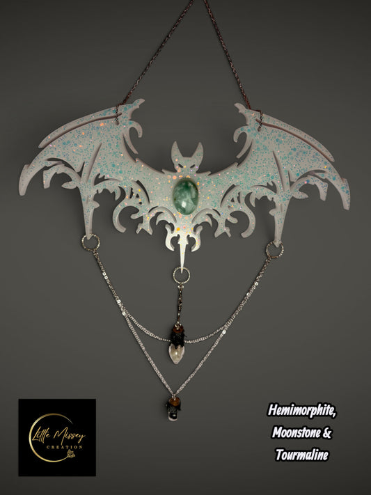 Little Missey Creation handcrafted resin bat wall hanging with iridescent glitter, hemimorphite, moonstone, and chains.
