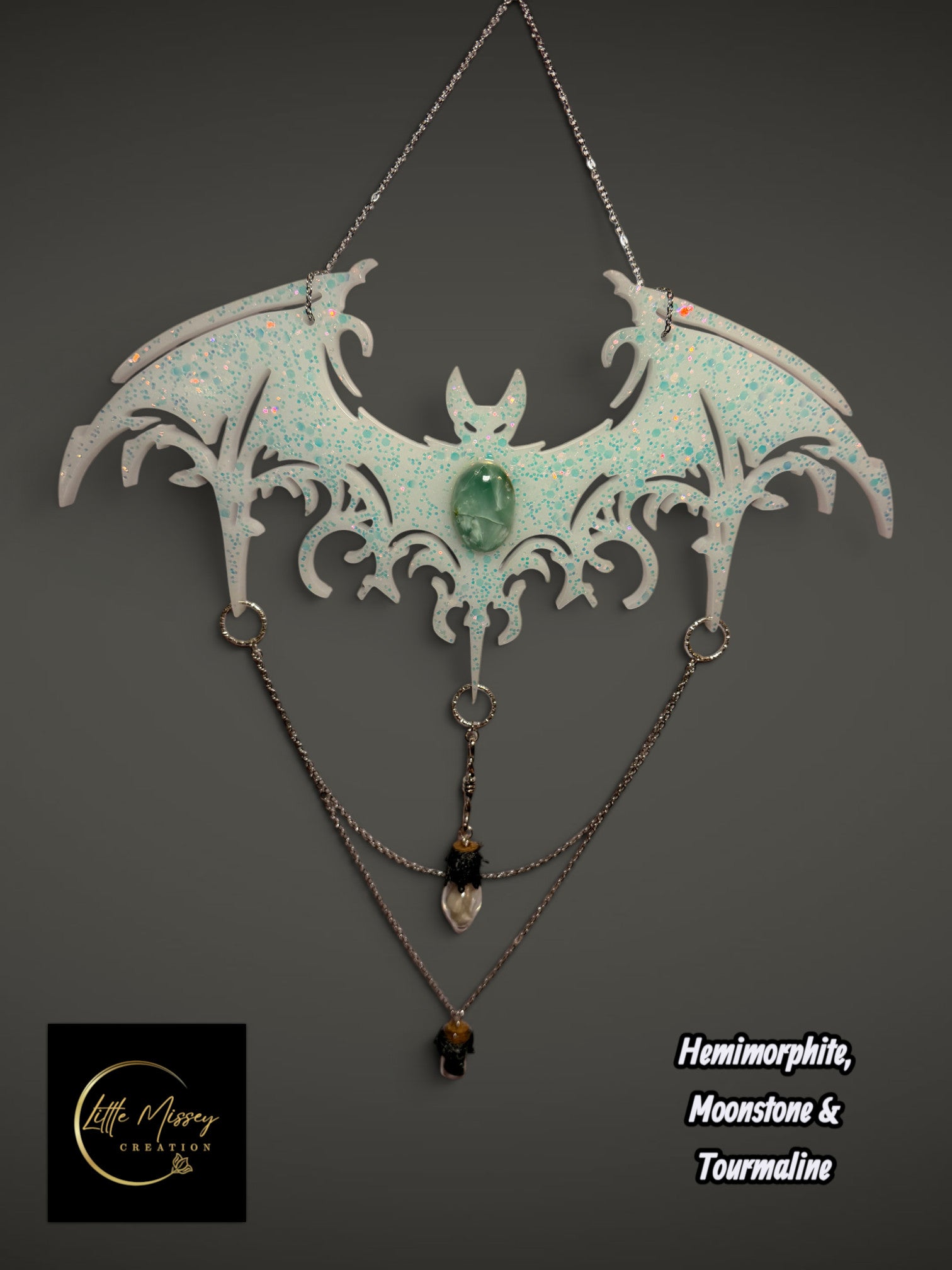 Little Missey Creation handcrafted resin bat wall hanging with iridescent glitter, hemimorphite, and crystal chains.
